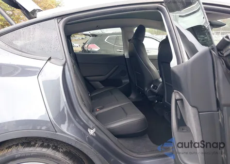 2023 Tesla Model Y Rwd из США, поврежденный, VIN 7SAYGDED6PF948385